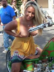 Blonde biker girlfriend flashes her big..